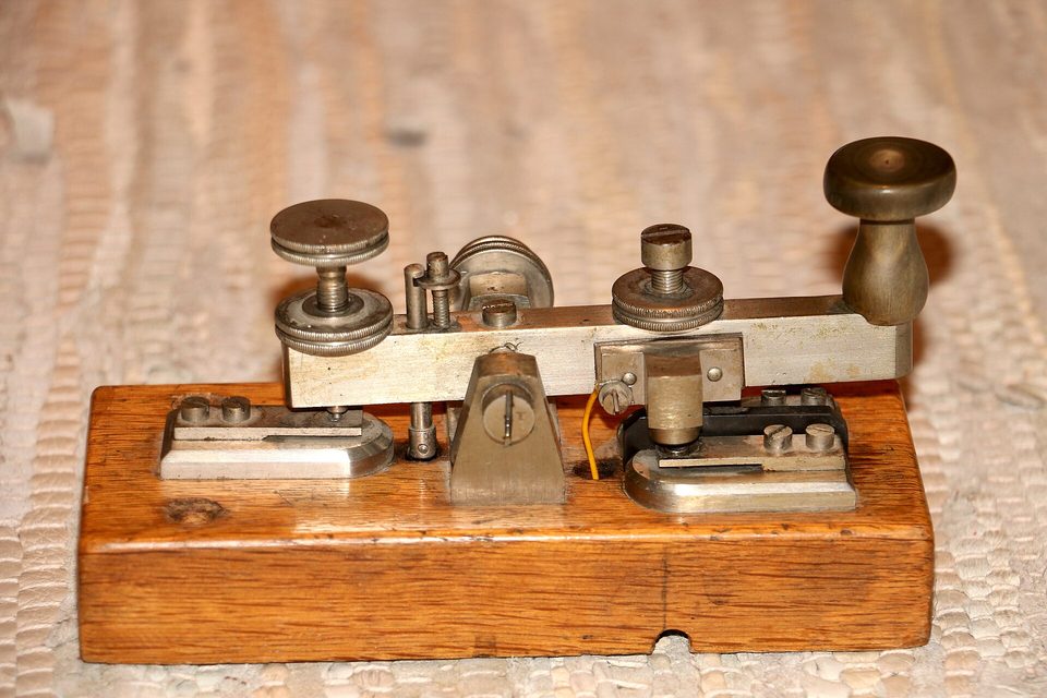 A telegraph key: between the press here and the click at the far end lies the whole journey