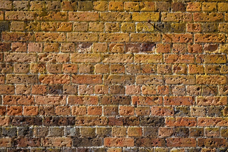 A brick bond: many small units carrying one wall