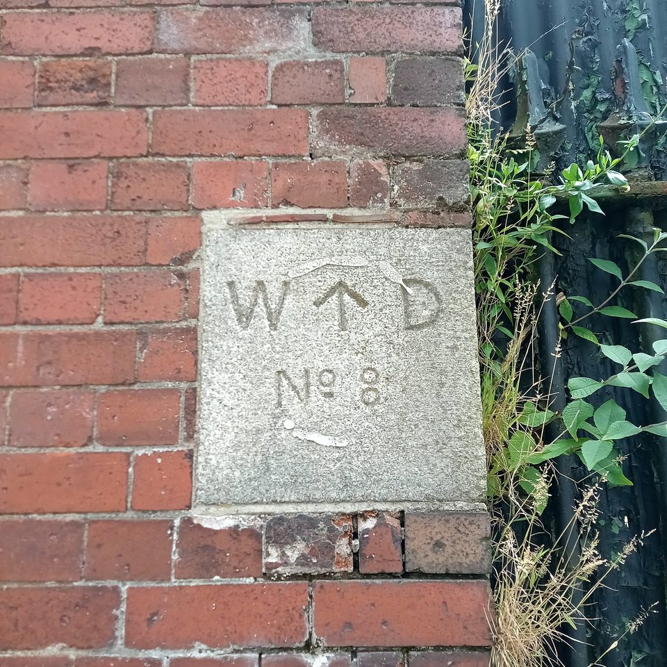 A boundary stone: the line is cut into the ground before anyone is asked to keep to it